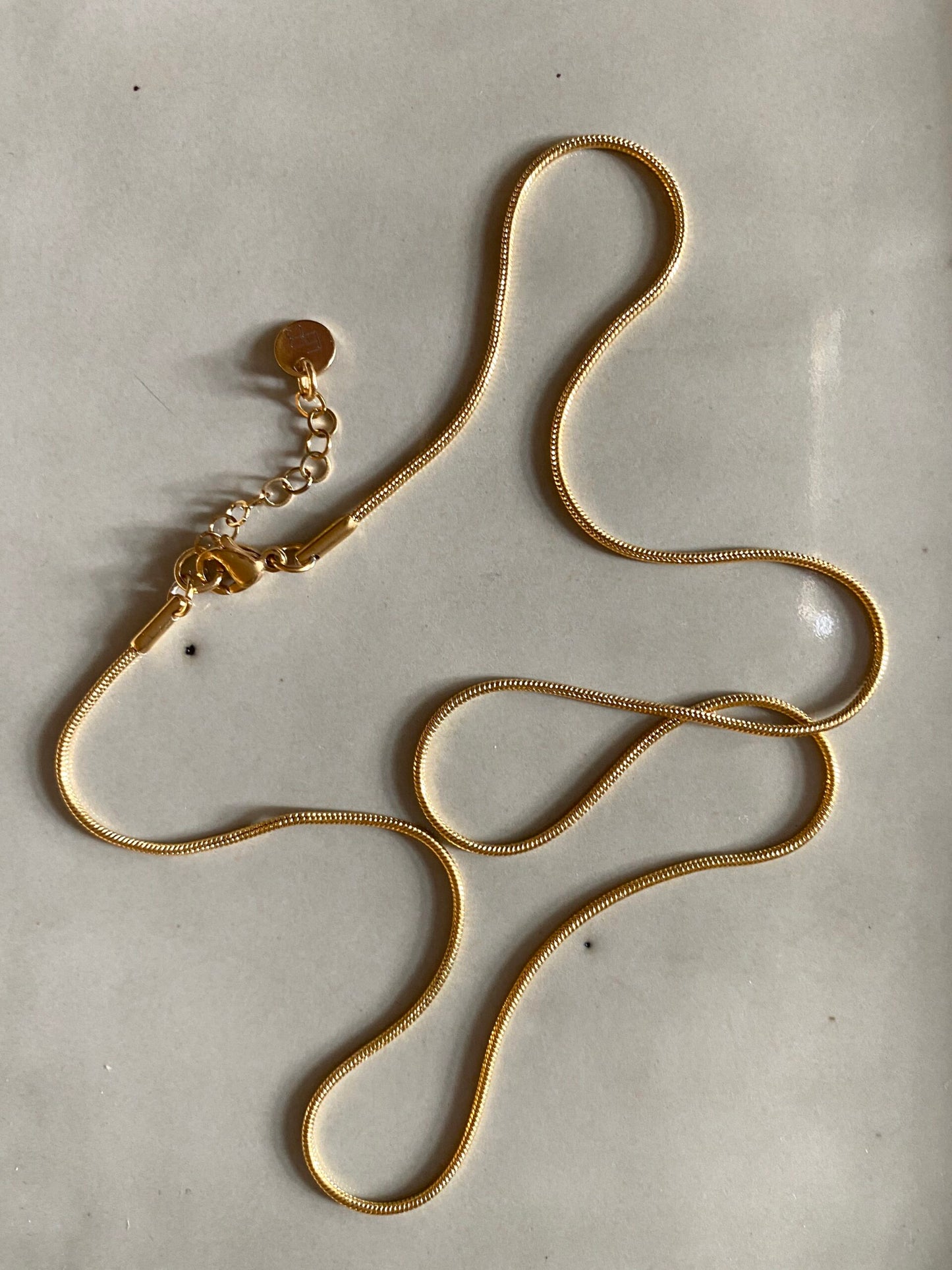 
                  
                    Small Gold Snake 4 Lengths Possible Necklace
                  
                
