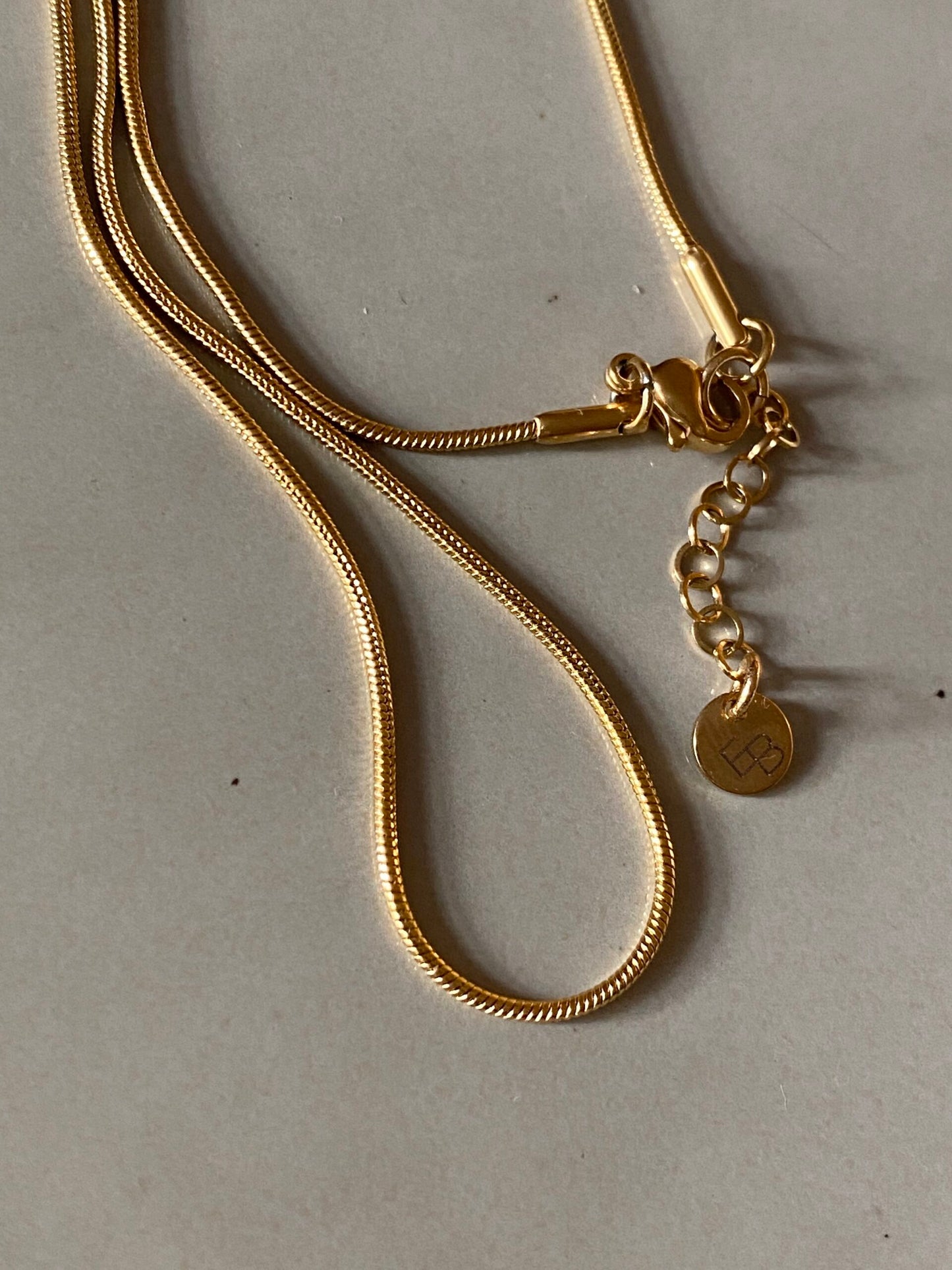 
                  
                    Small Gold Snake 4 Lengths Possible Necklace
                  
                