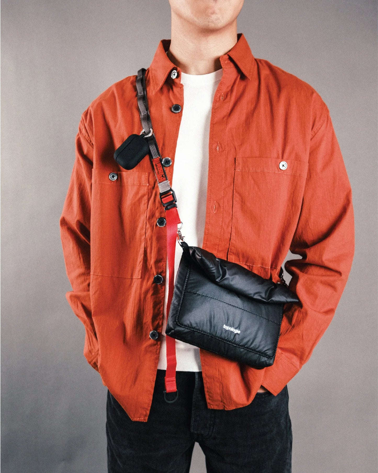 
                  
                    Black Puffer Musette Mini Bag With Future Blue Solid Rope Strap
                  
                