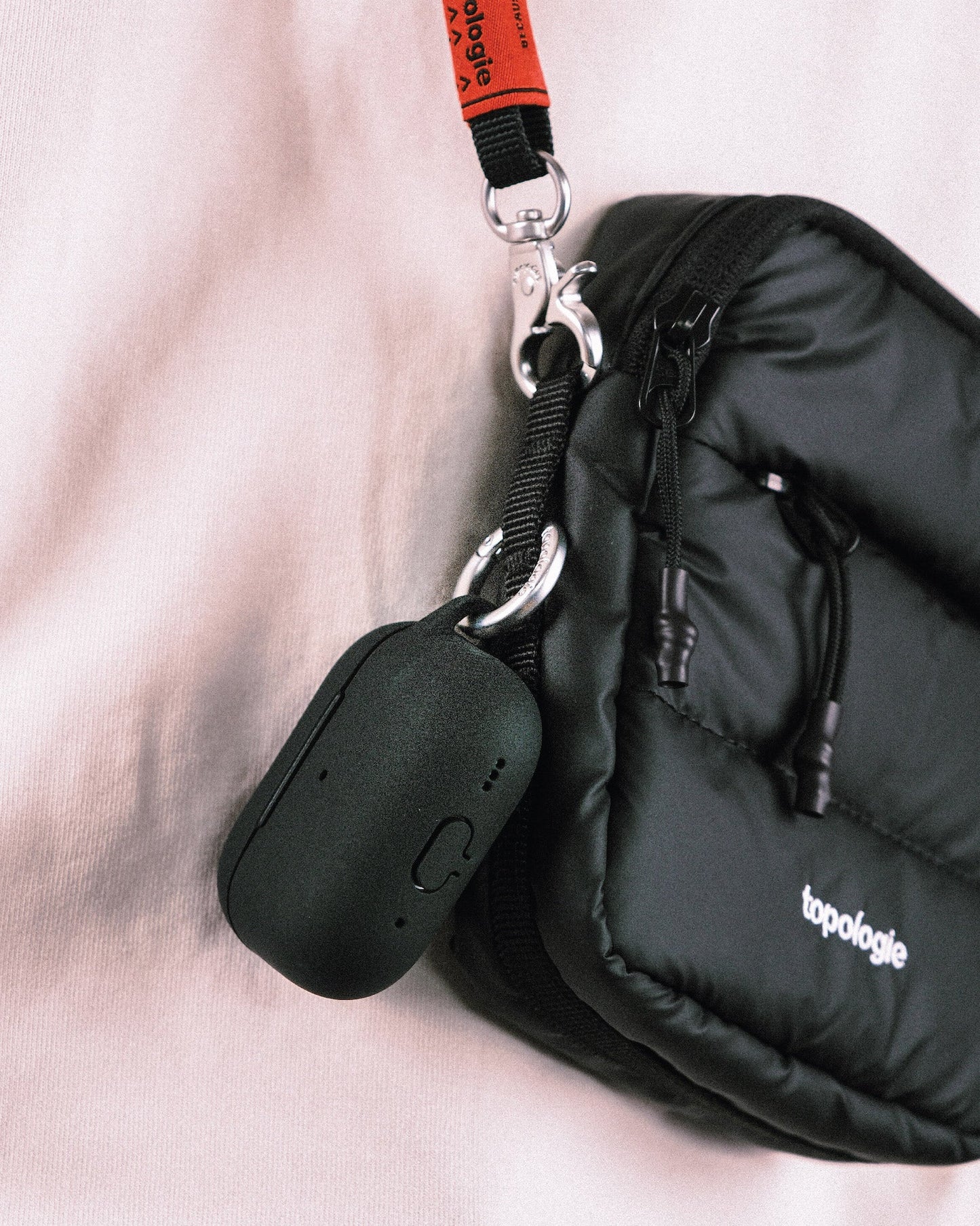 
                  
                    Black Puffer Tinbox Mini Bag With Future Blue Solid Rope Strap
                  
                