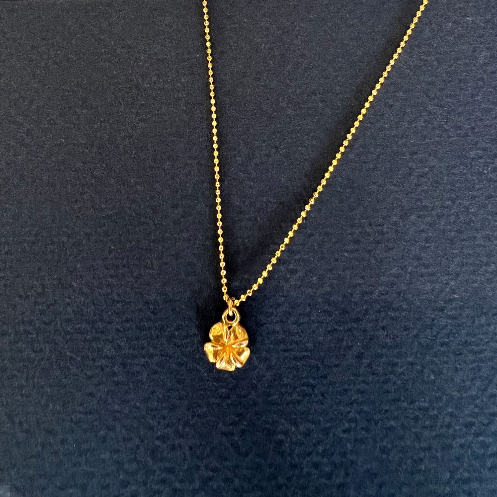 
                  
                    Golden Frangipani Flower Necklace
                  
                