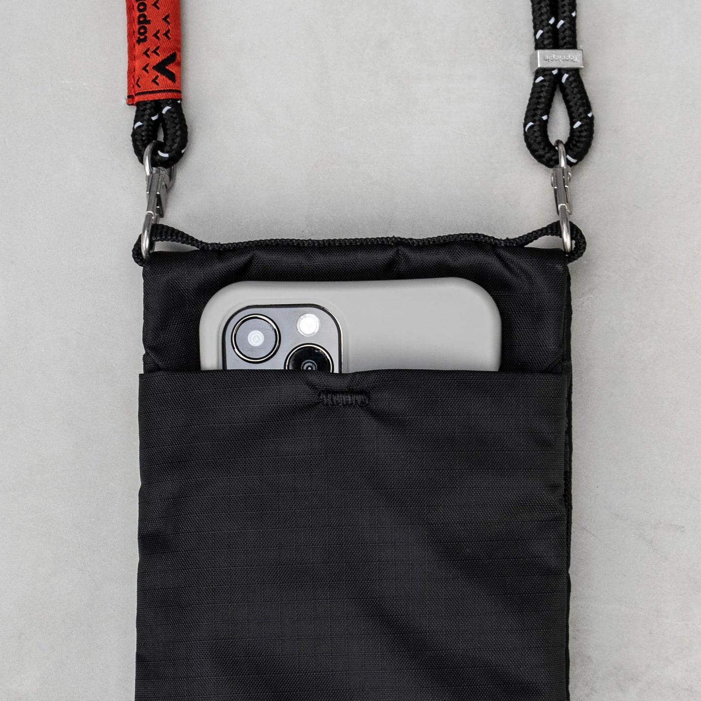 
                  
                    Black Light Phone Sacoche Bag With Peach Melange Rope Strap
                  
                