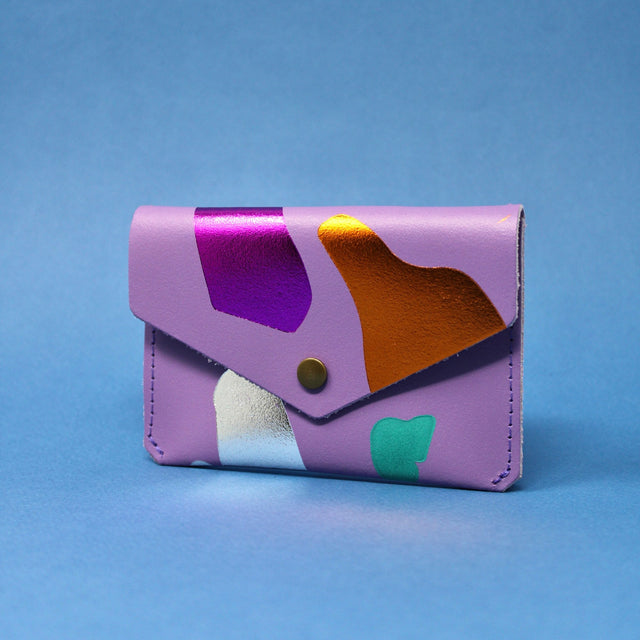 
                  
                    Lilac Abstract Leather Popper Purse
                  
                