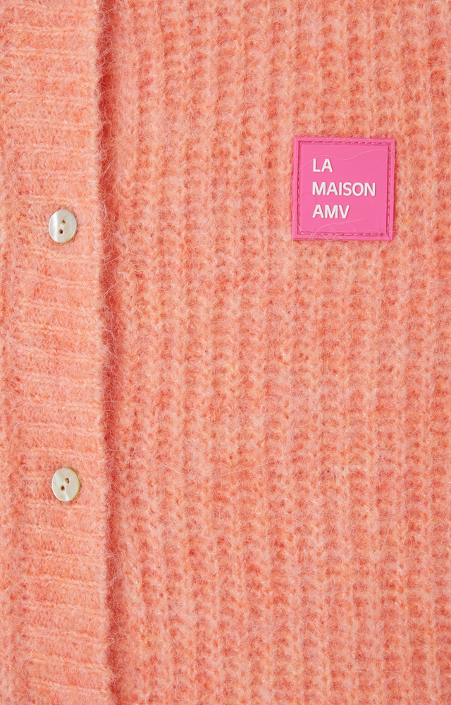 
                  
                    EAST – Ärmellose Strickjacke in Weiß-Pfirsich-Melange
                  
                