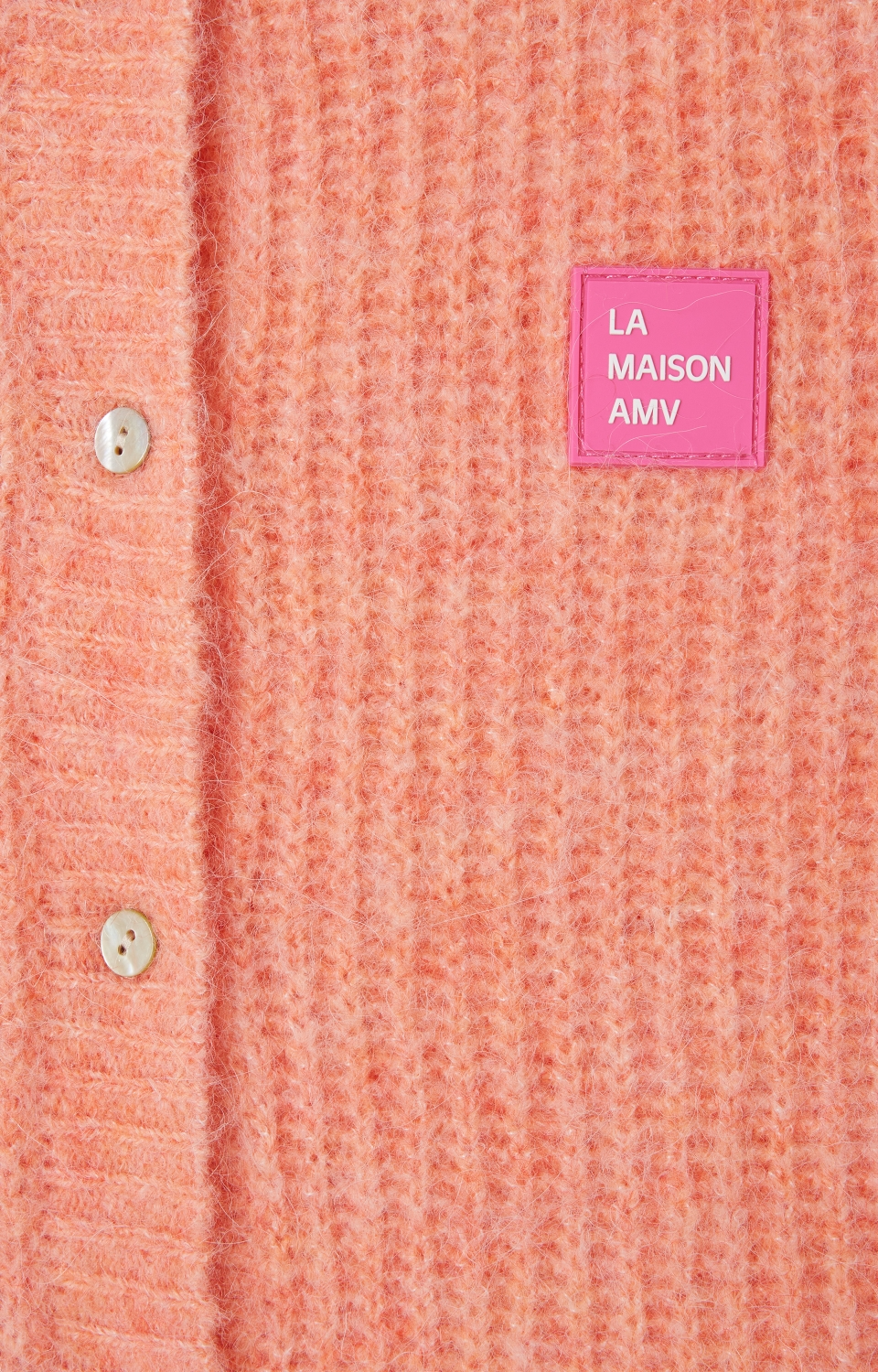 
                  
                    EAST – Ärmellose Strickjacke in Weiß-Pfirsich-Melange
                  
                