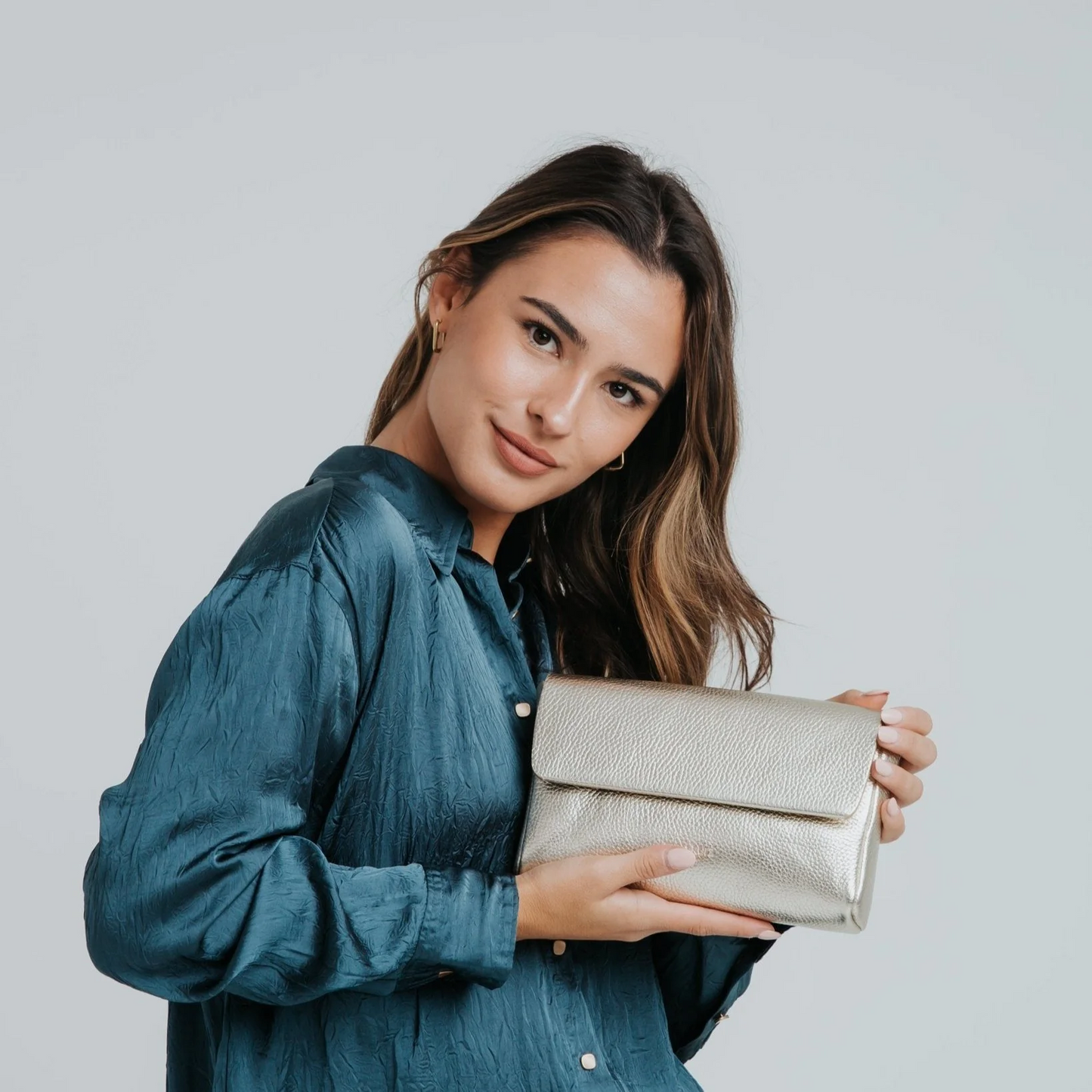 
                  
                    Champagne Metallic Large Pack Shape Bag
                  
                
