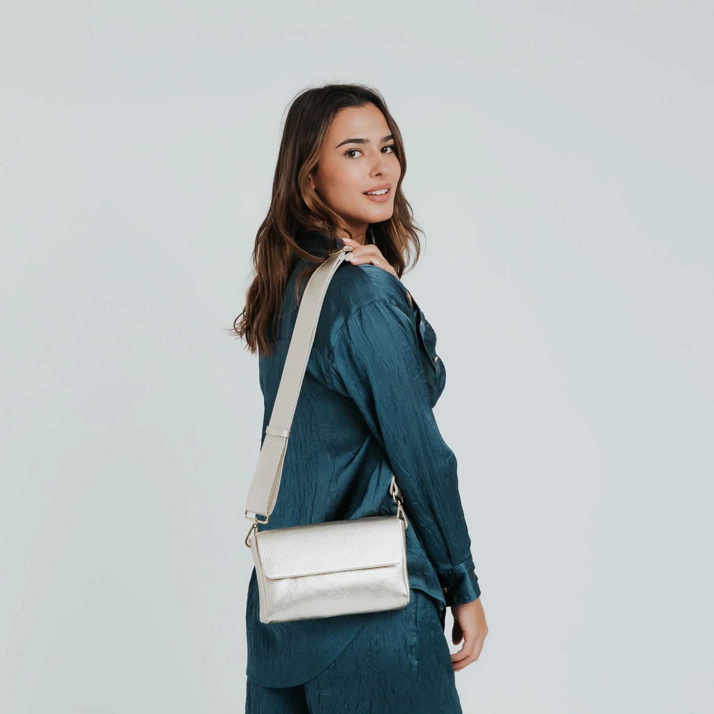 
                  
                    Champagne Metallic Large Pack Shape Bag
                  
                