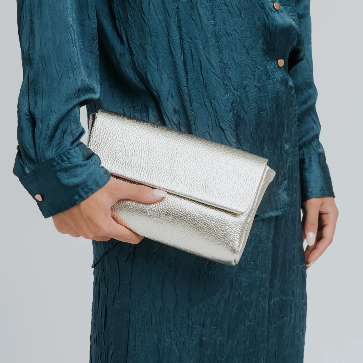 
                  
                    Champagne Metallic Large Pack Shape Bag
                  
                
