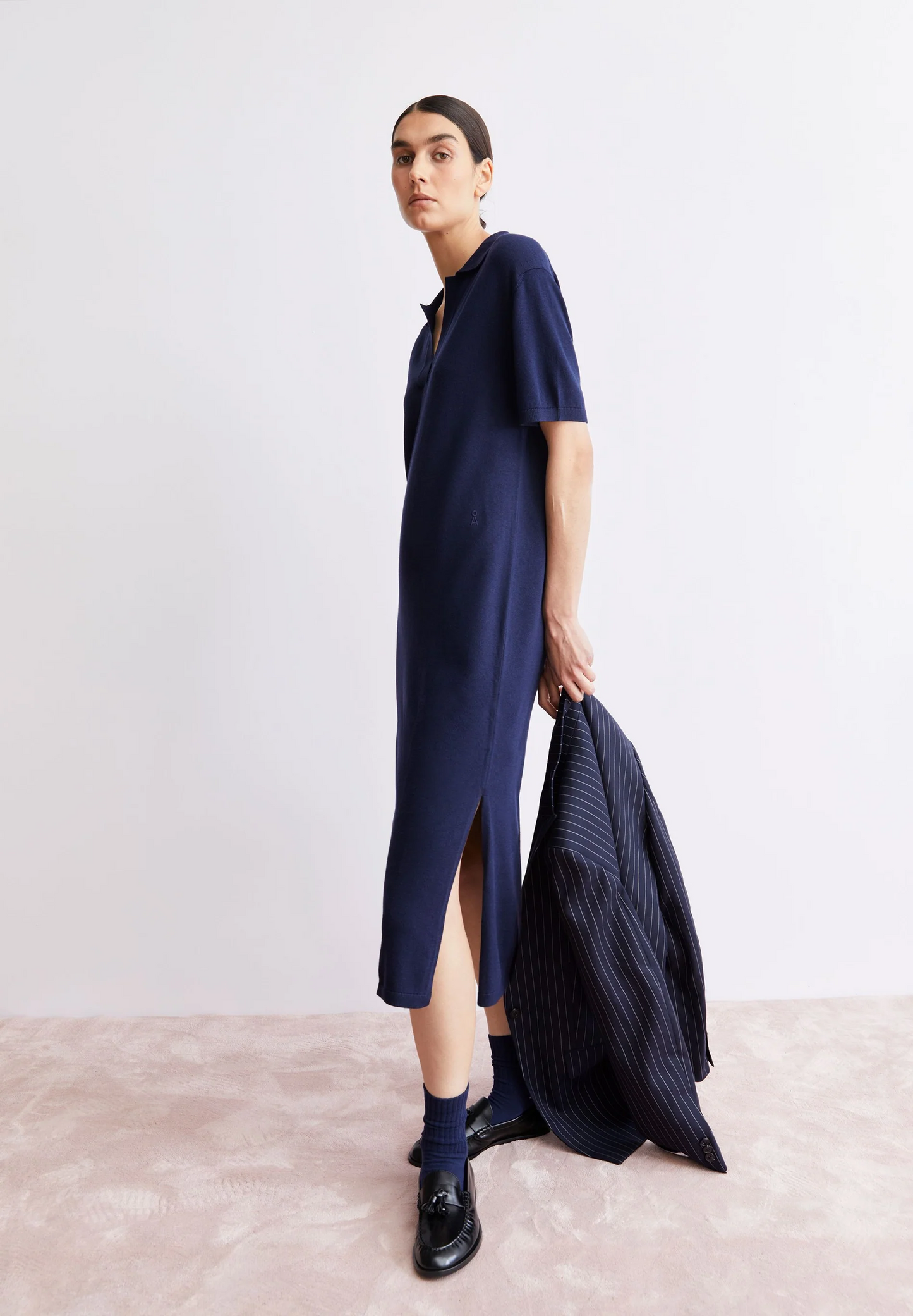 
                  
                    GETRIEBENES MARINEBLAUES FEINES POLO-STRICKKLEID
                  
                