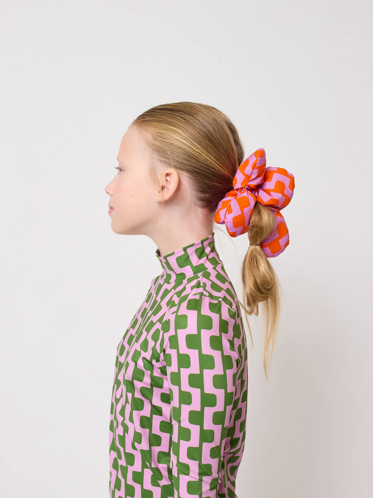 
                  
                    Haargummi mit Kette und Blume
                  
                