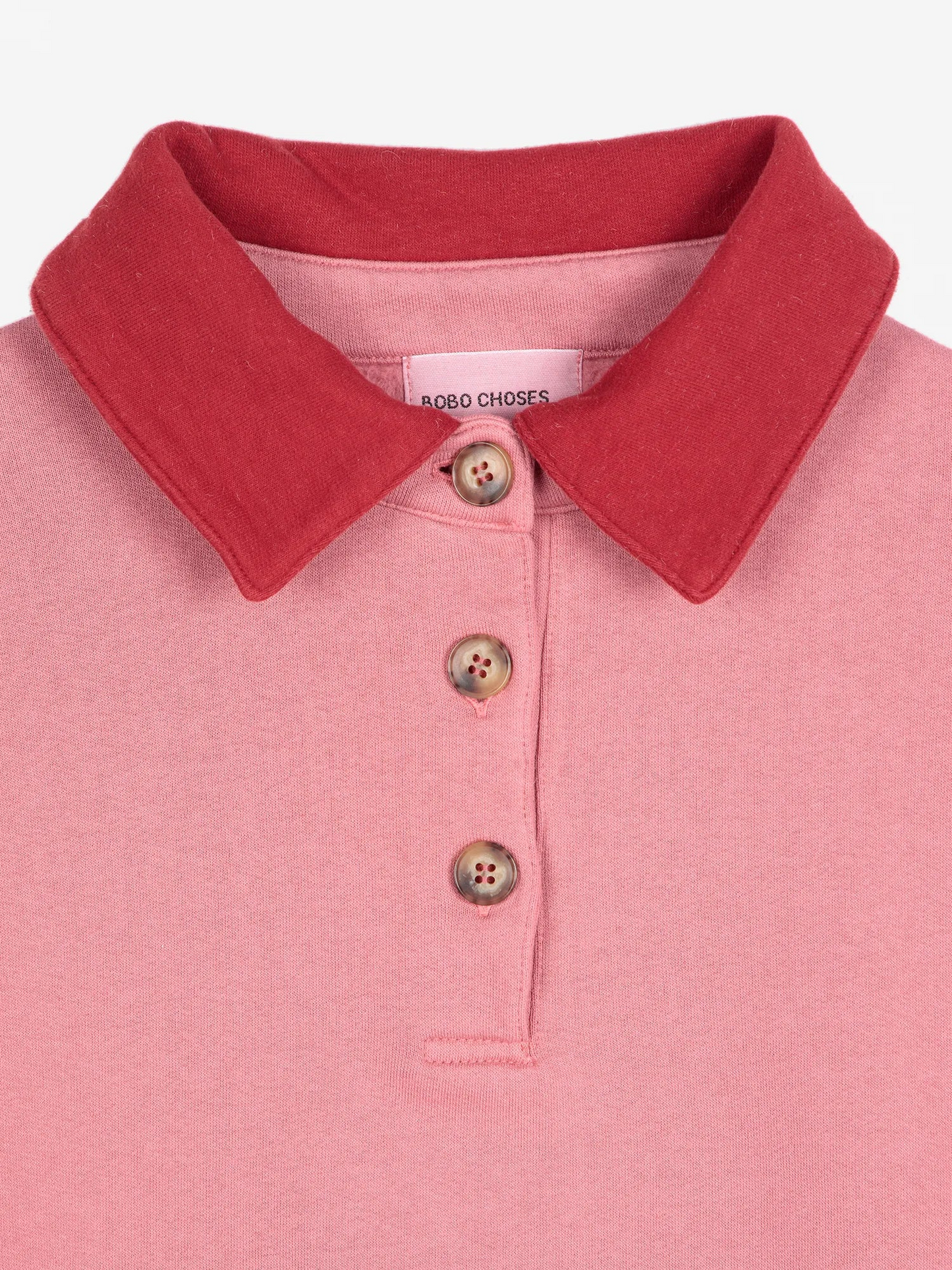 
                  
                    Rosa Polo-Oversize-Pullover mit Colorblock-Muster
                  
                