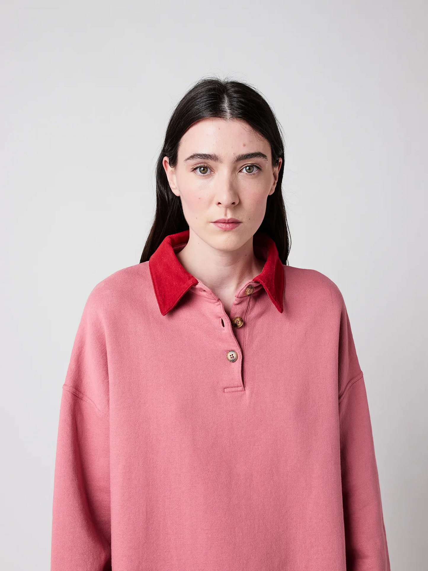 
                  
                    Rosa Polo-Oversize-Pullover mit Colorblock-Muster
                  
                