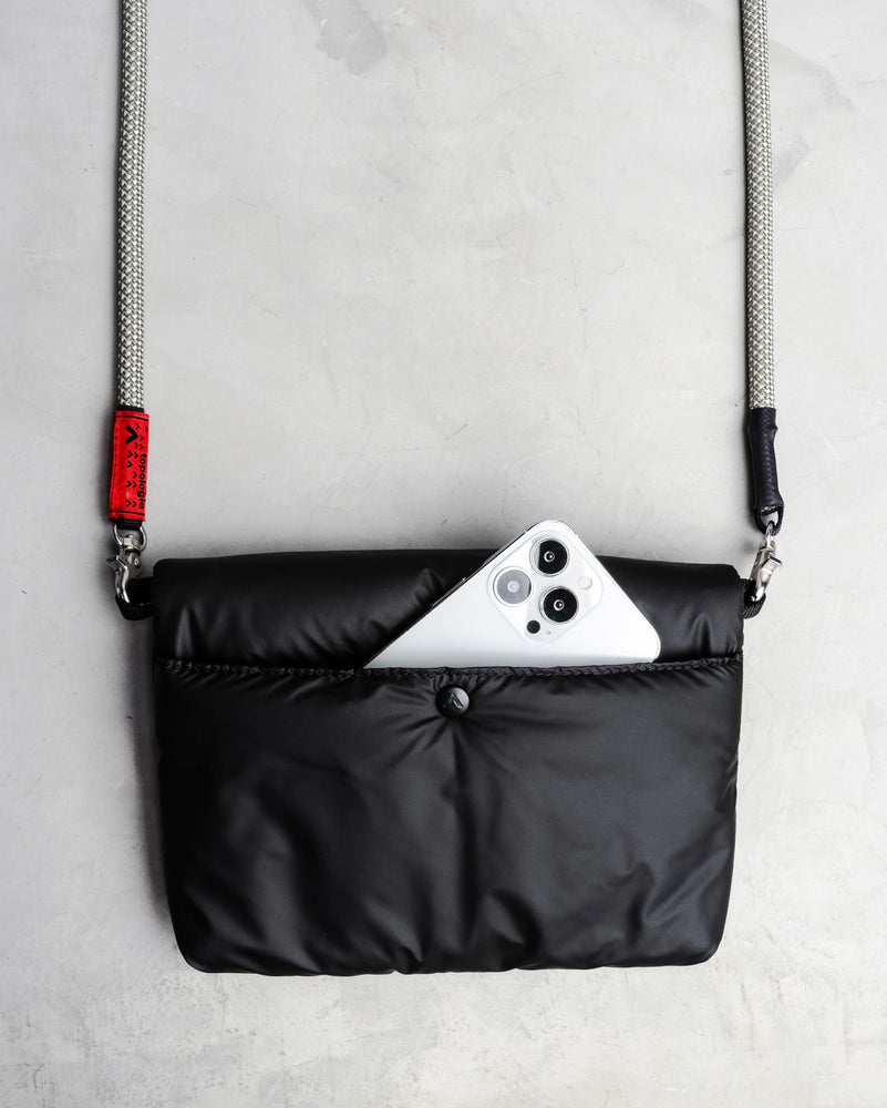 
                  
                    Black Puffer Musette Mini Bag With Future Blue Solid Rope Strap
                  
                