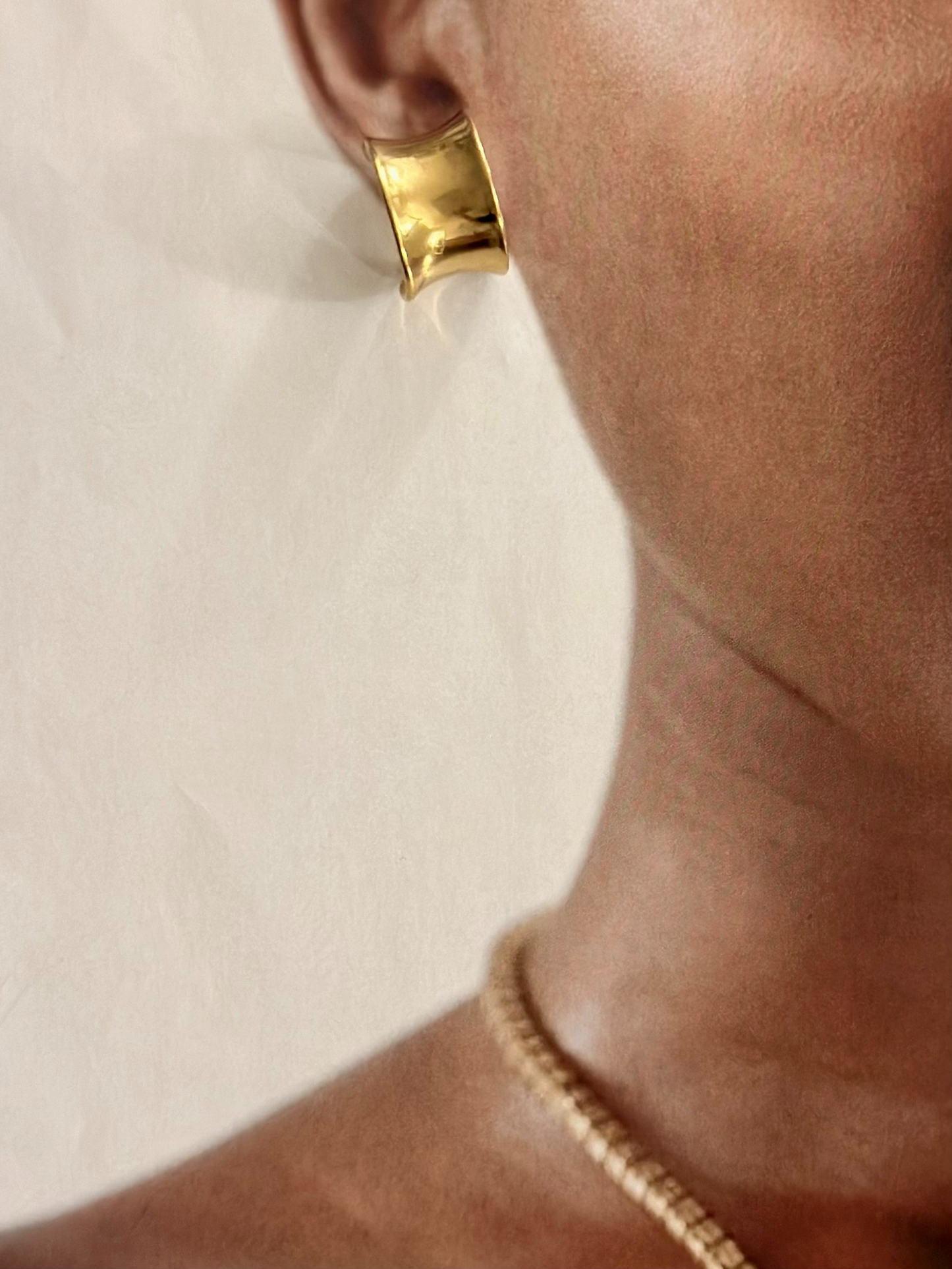
                  
                    Gold Wide Short Earrings
                  
                