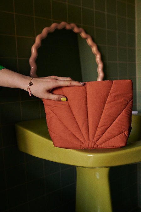
                  
                    LA PROMENADE Croissant Brown Padded Toiletry Bag
                  
                
