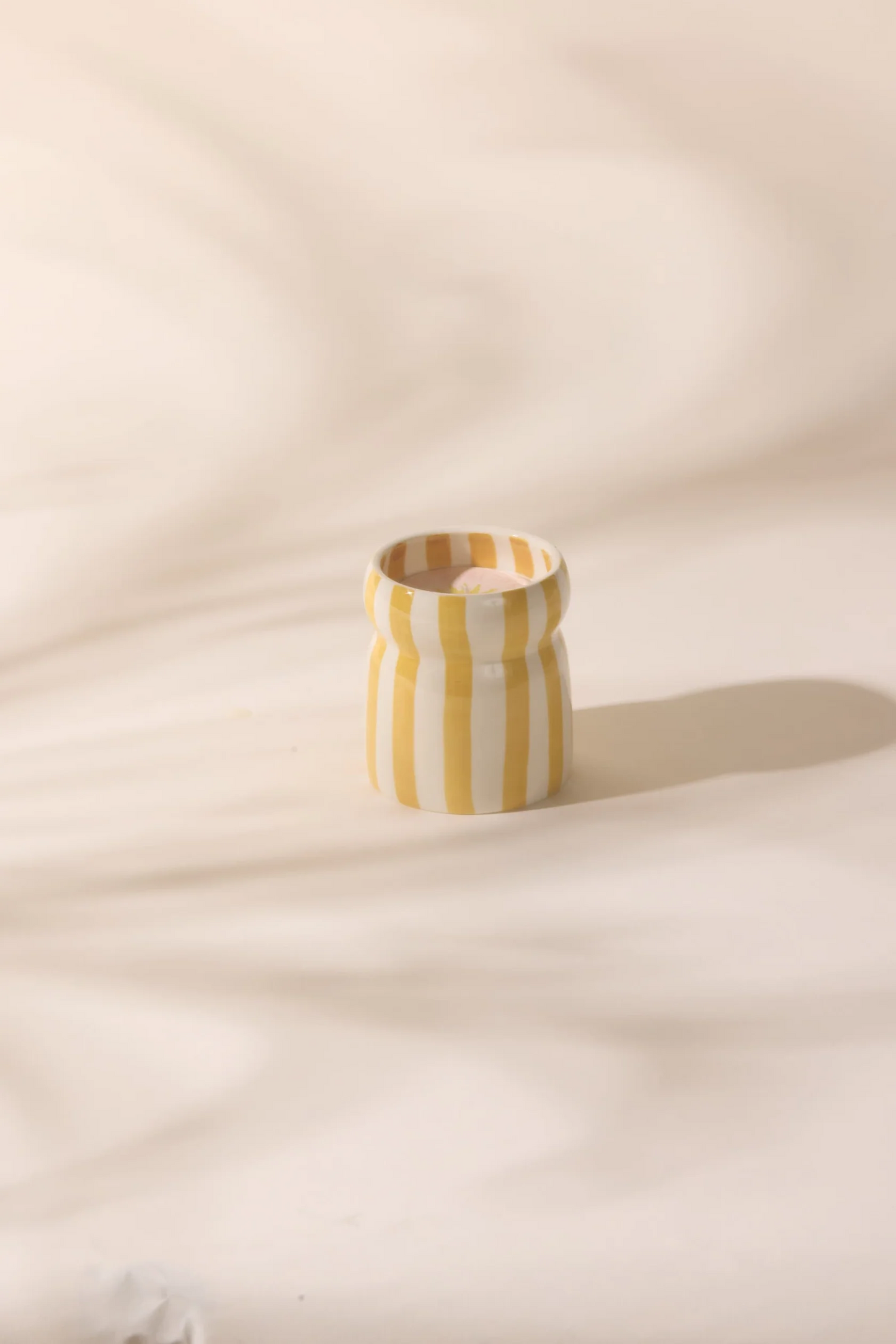 
                  
                    CABANA Ochre Gold Coast Striped Ceramic Candle
                  
                