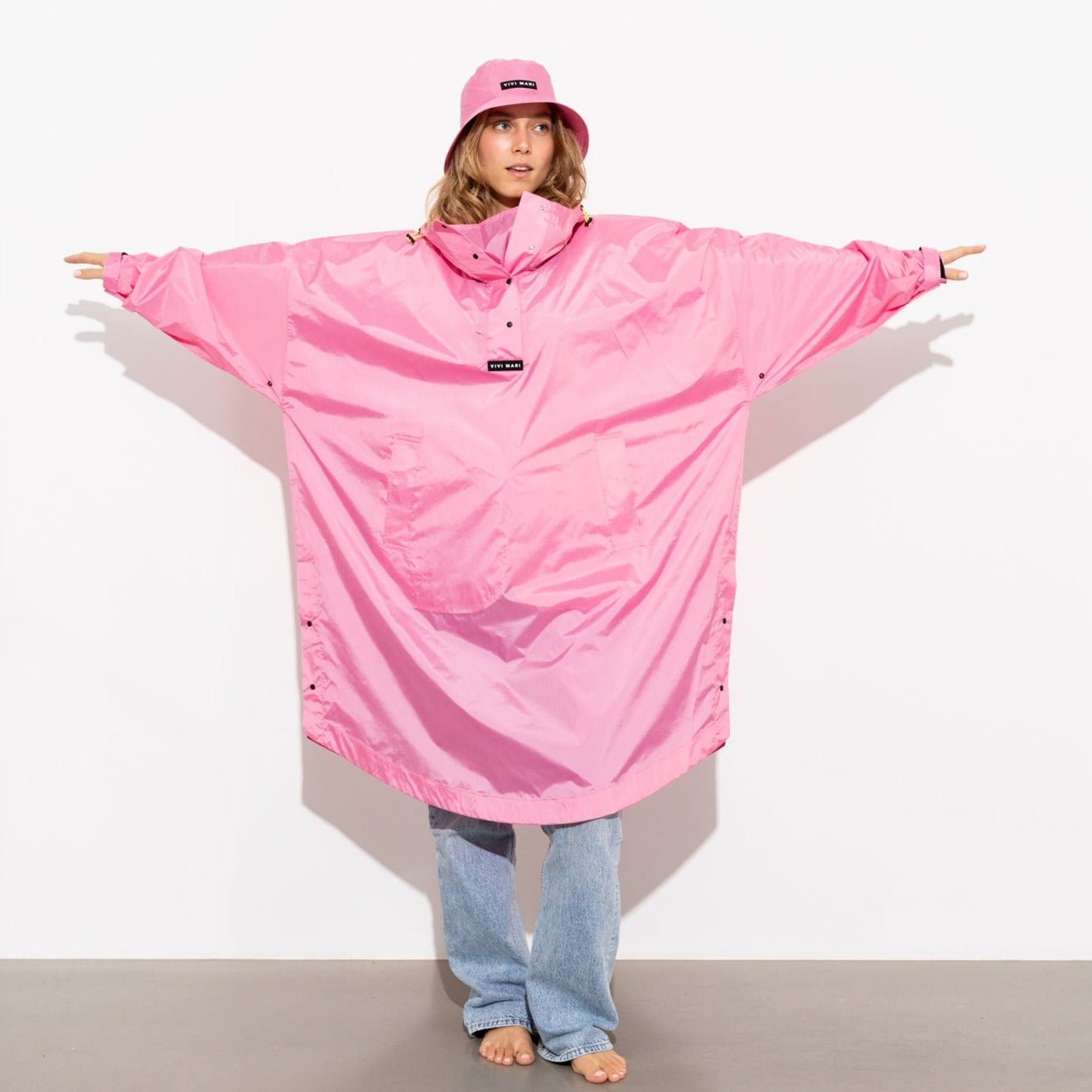 
                  
                    Weicher, einfarbiger Regenmantel in Rosa
                  
                