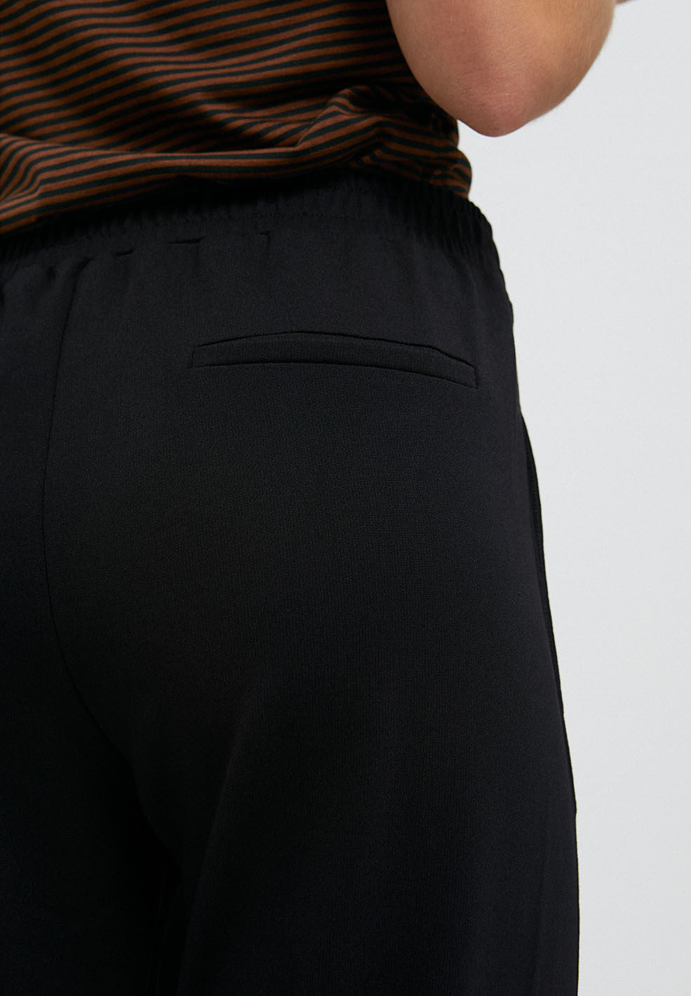 
                  
                    MAGDAA Black Jersey Pants
                  
                